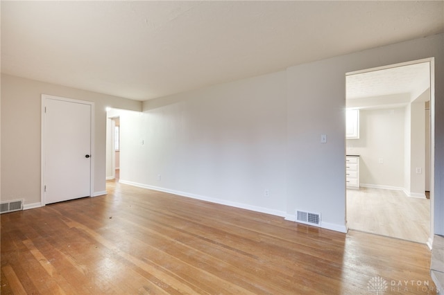 empty room featuring hardwood / wood-style flooring