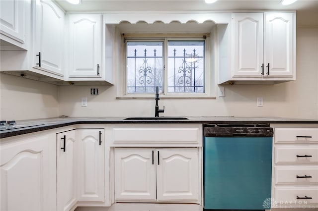 kitchen featuring white cabinetry, dishwashing machine, and sink