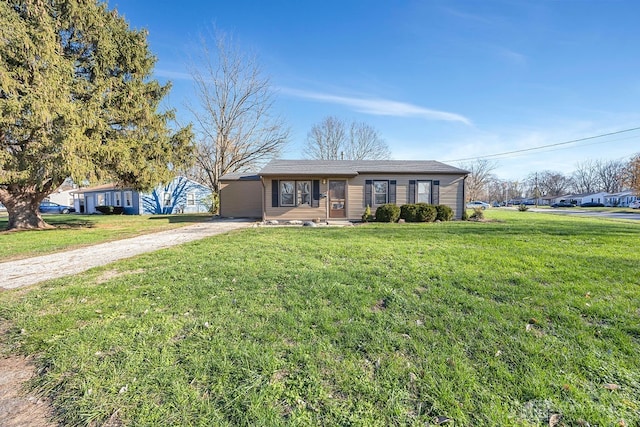 single story home with a carport and a front lawn