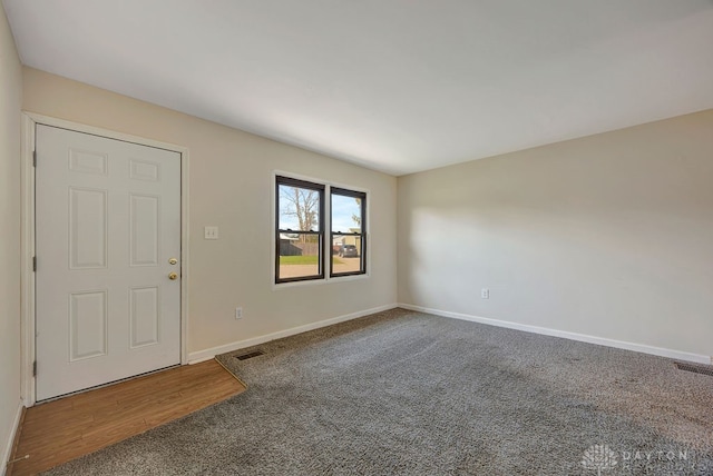 view of carpeted entrance foyer