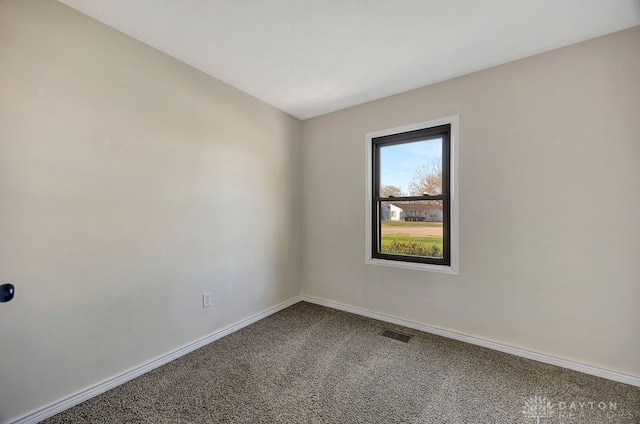 empty room featuring carpet flooring