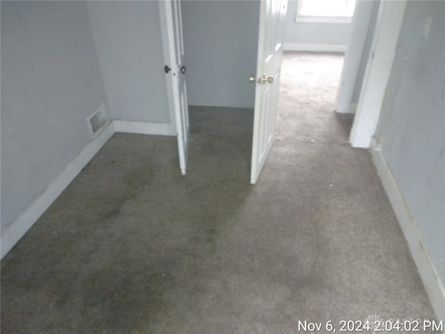 interior space featuring dark colored carpet