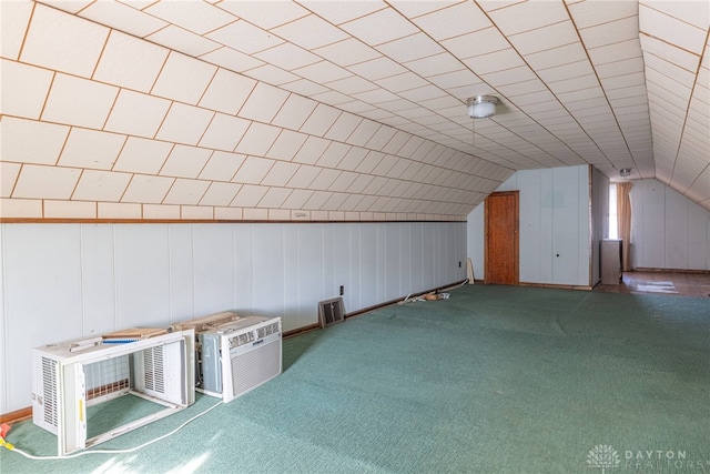 bonus room featuring carpet floors and vaulted ceiling