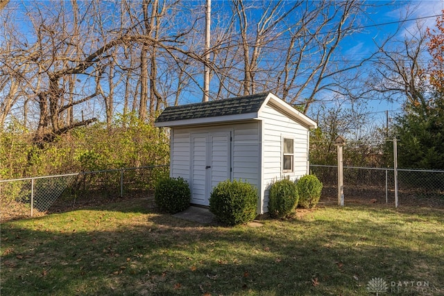 view of outbuilding with a yard