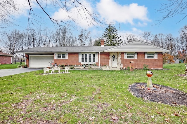 ranch-style home with a garage and a front lawn