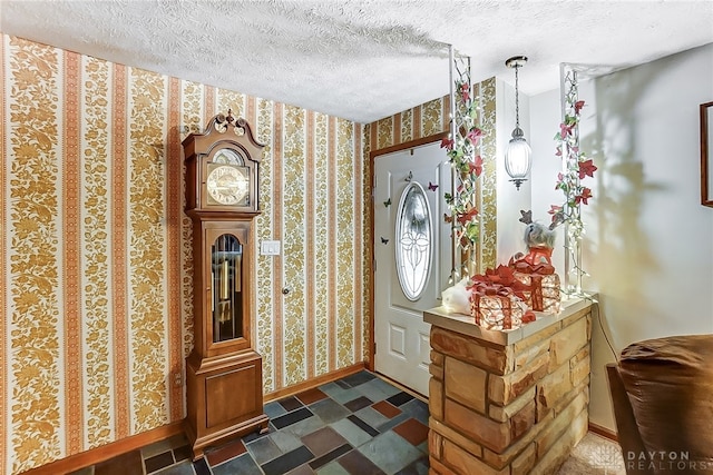 foyer entrance featuring a textured ceiling