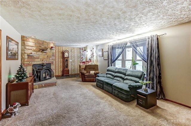 carpeted living room featuring a textured ceiling and a wood stove