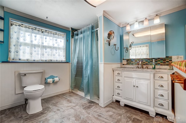 bathroom with toilet, vanity, and a shower with shower curtain