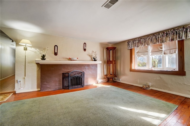 unfurnished living room featuring hardwood / wood-style floors