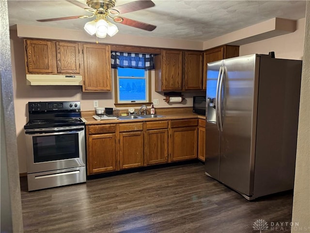 kitchen with dark hardwood / wood-style flooring, ceiling fan, sink, and appliances with stainless steel finishes