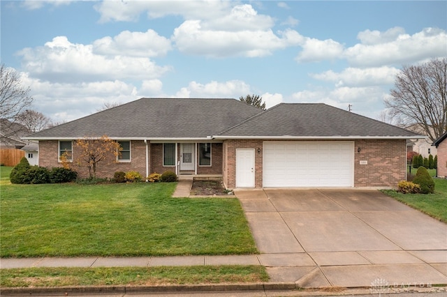 single story home featuring a garage and a front lawn