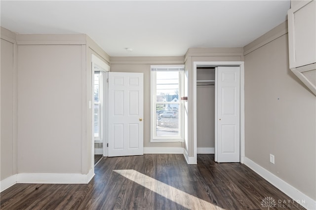 interior space featuring dark hardwood / wood-style floors and a closet