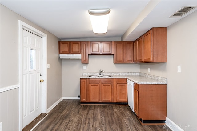 kitchen featuring dishwasher, sink, and dark hardwood / wood-style floors