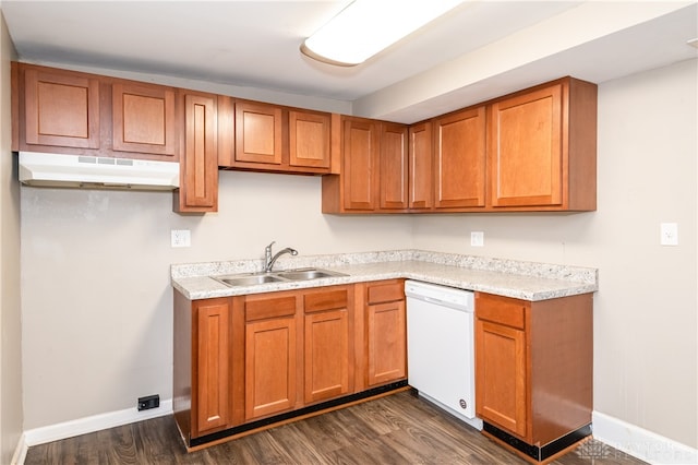 kitchen with dark hardwood / wood-style flooring, sink, and white dishwasher