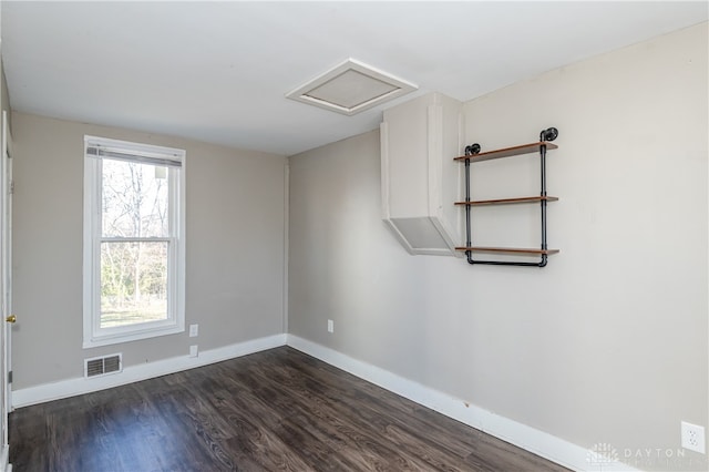 empty room featuring dark hardwood / wood-style floors