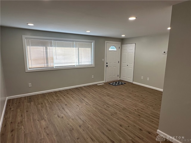 foyer entrance with dark wood-type flooring