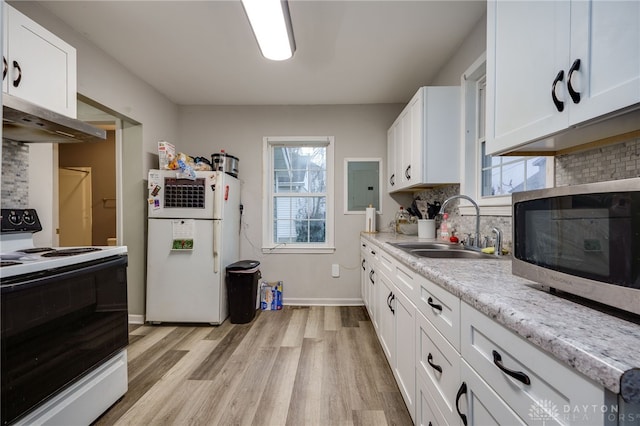 kitchen featuring sink, white cabinets, white appliances, and light wood-type flooring