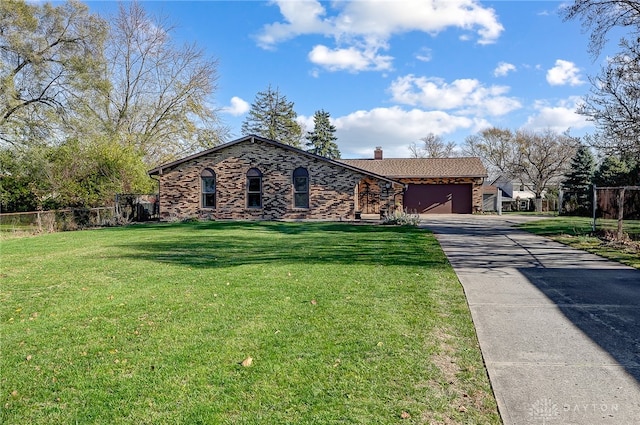 single story home featuring a front lawn and a garage