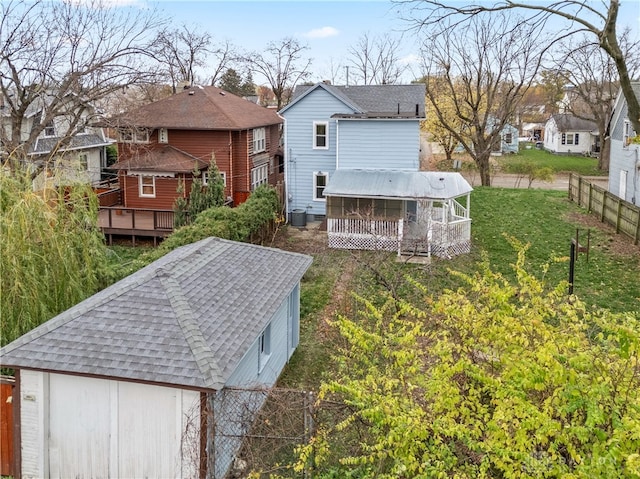 back of house with a wooden deck and central AC unit