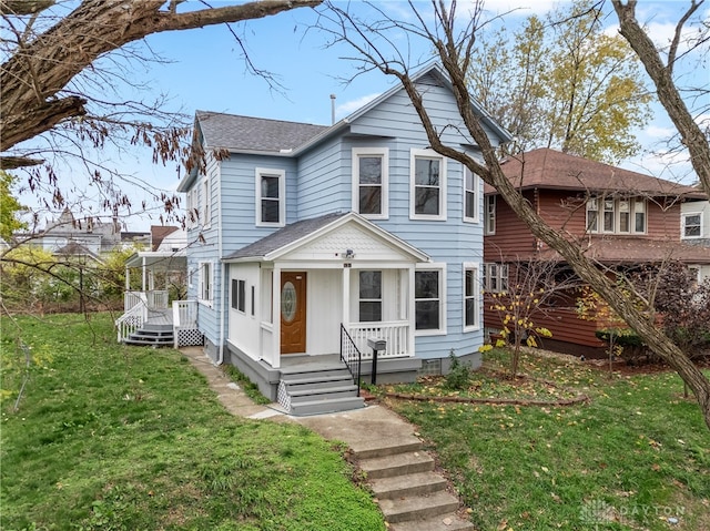 view of front of home with a front lawn