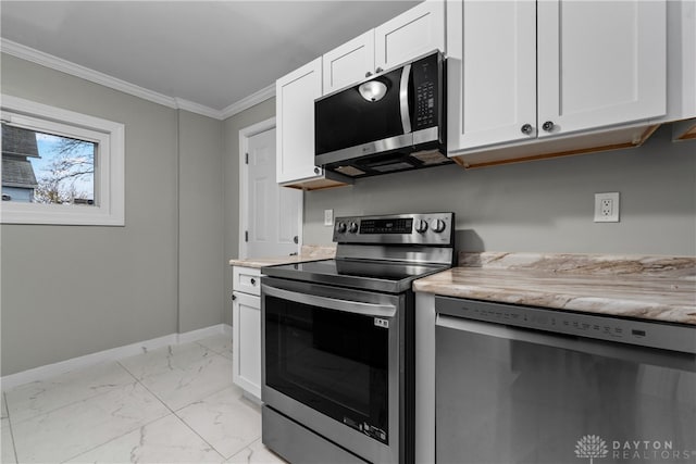 kitchen featuring white cabinets, crown molding, and stainless steel appliances