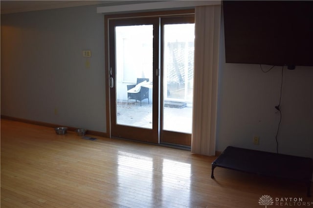 spare room featuring light wood-type flooring