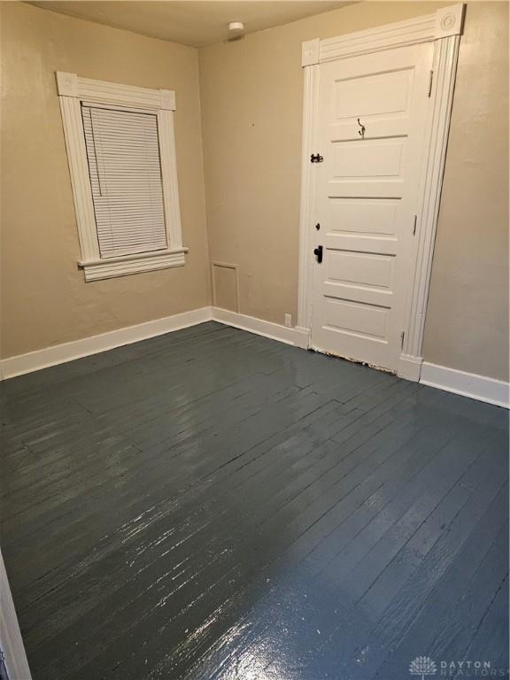 foyer with dark hardwood / wood-style floors