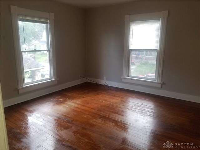 empty room featuring dark hardwood / wood-style floors