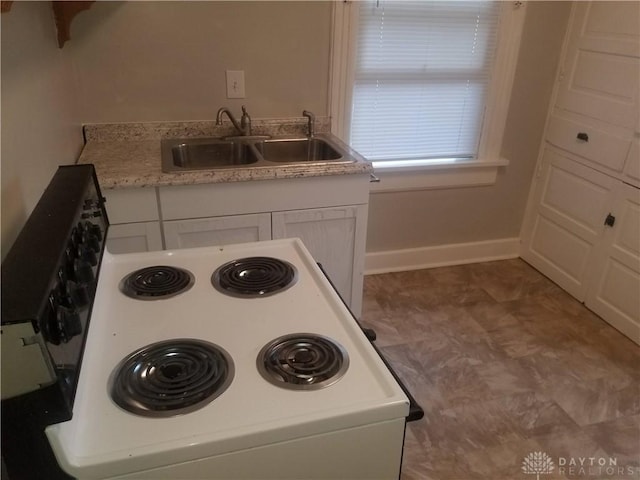 kitchen with white cabinets and sink