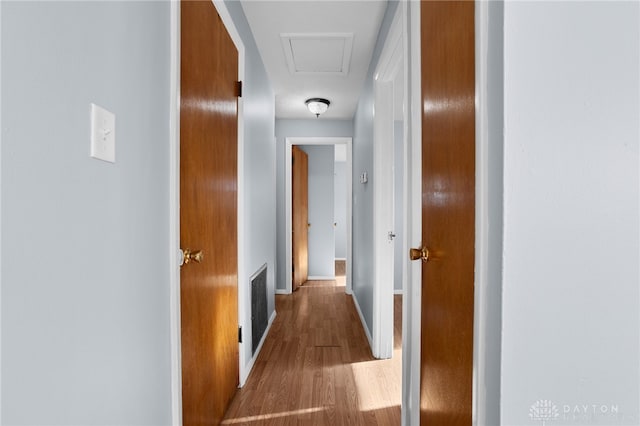 corridor with wood-type flooring