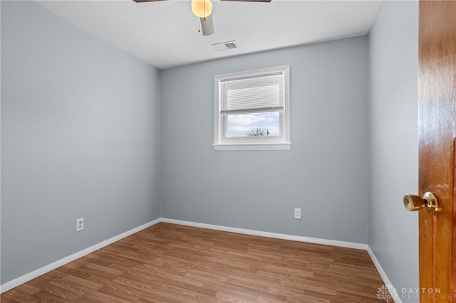 spare room with ceiling fan and light hardwood / wood-style floors