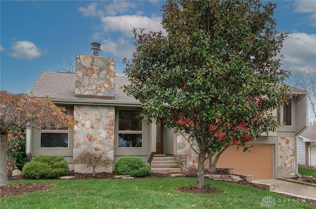 view of front facade featuring a front yard and a garage