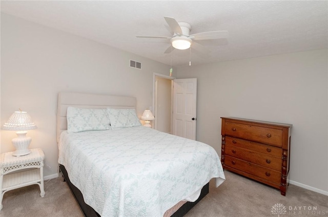 bedroom featuring light carpet and ceiling fan