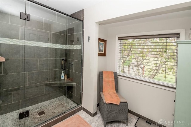 bathroom featuring tile patterned floors and an enclosed shower