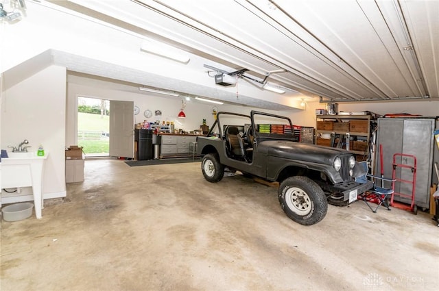 garage with sink and a garage door opener