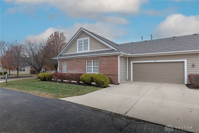 view of front of home featuring a garage and a front yard