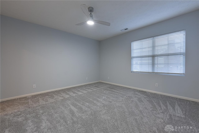 carpeted empty room featuring ceiling fan