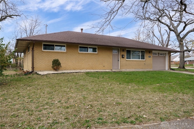 ranch-style home with a front yard and a garage