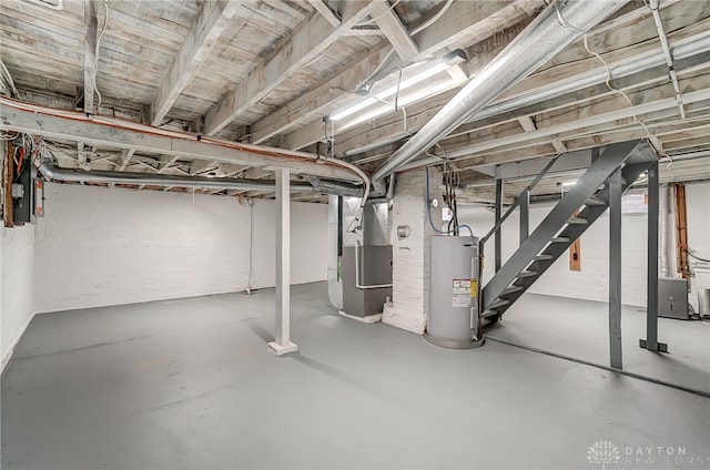 basement with electric water heater and heating unit