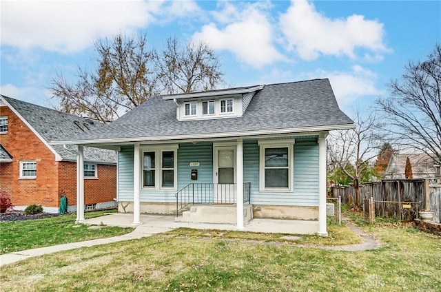 bungalow-style home with a porch and a front yard