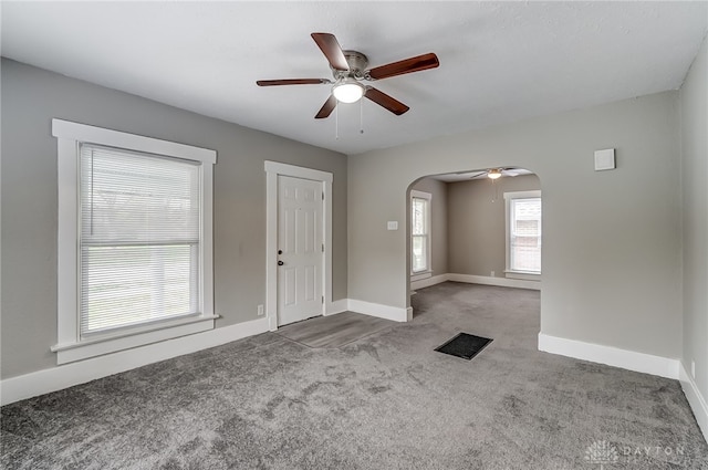 interior space featuring carpet and ceiling fan