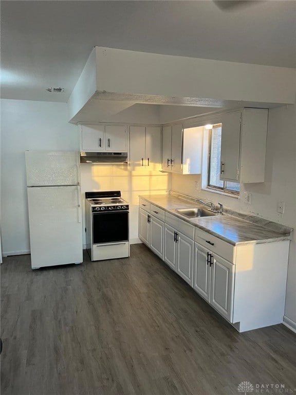 kitchen featuring white cabinetry, sink, dark wood-type flooring, and white appliances