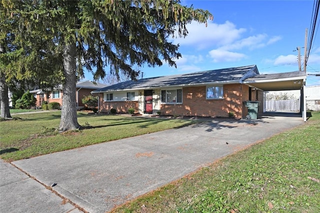 ranch-style home featuring a front yard and a carport