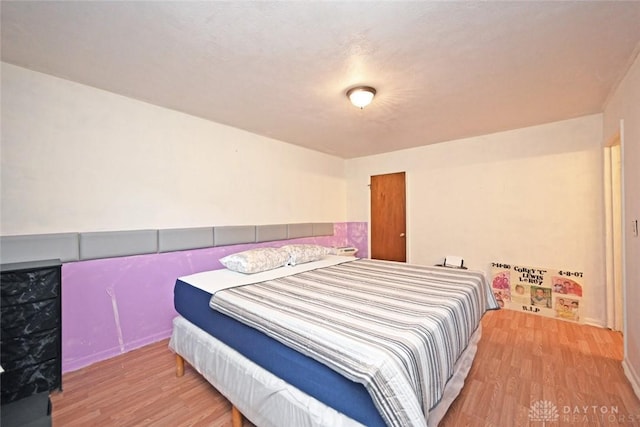 bedroom with light hardwood / wood-style flooring