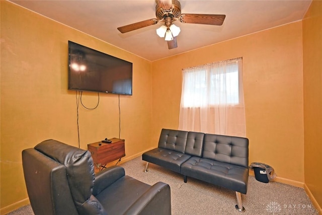 living room with ceiling fan and carpet floors