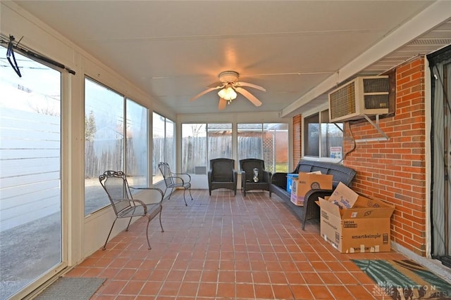 sunroom / solarium featuring ceiling fan and a healthy amount of sunlight