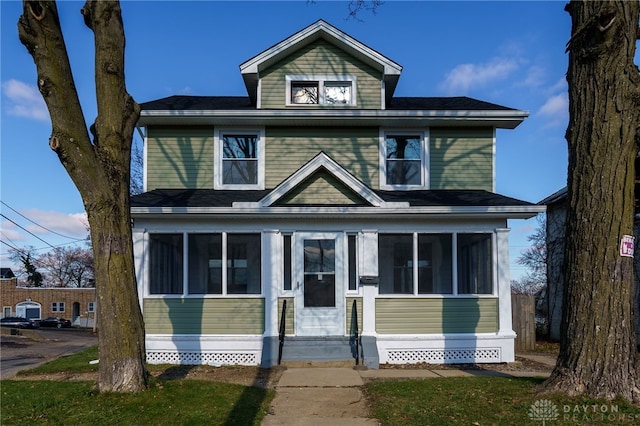 front of property with a sunroom