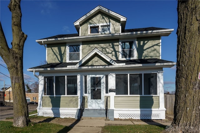 view of front of home with a sunroom