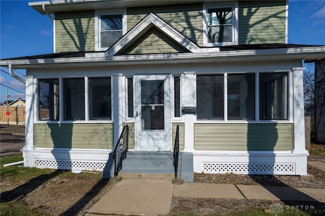 view of front facade featuring a sunroom