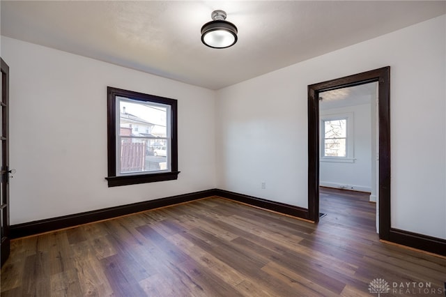 empty room featuring dark wood-type flooring